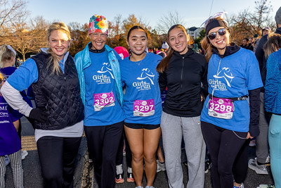 five Girls on the Run coaches posing for a picture with their arms around each other at the 5K.